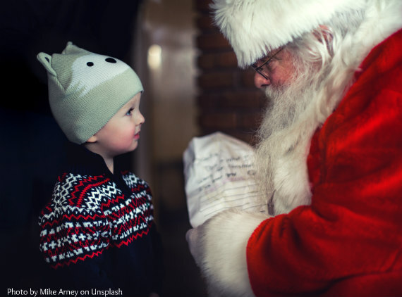 Santa_Claus_and_Child_with_List__Mike_Arney_unsplash.jpg
